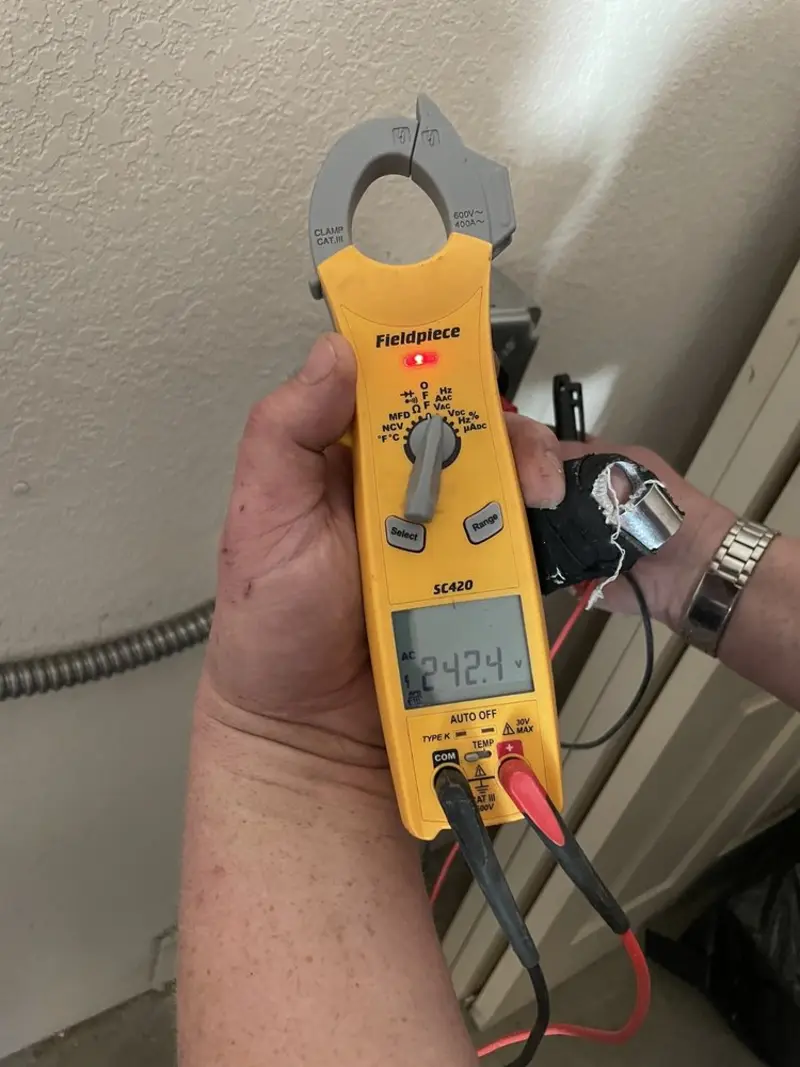 Voltage testing with clamp meter during Ceiling Fan Installation in Deerfield
